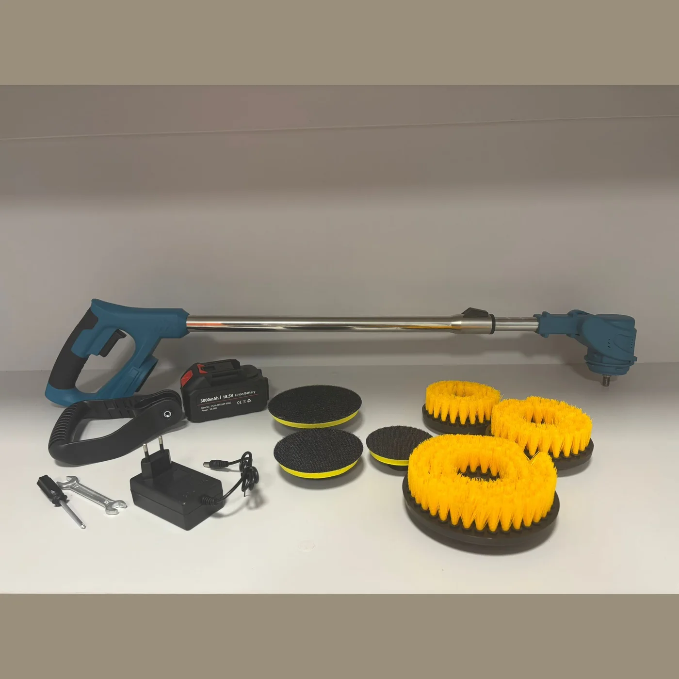 Scrubber, battery, side handle and the six heads side by side